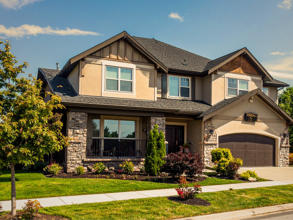 Front of a residential home with a green front yard
